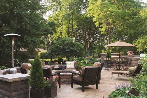 Outdoor speakers placed throughout a backyard.